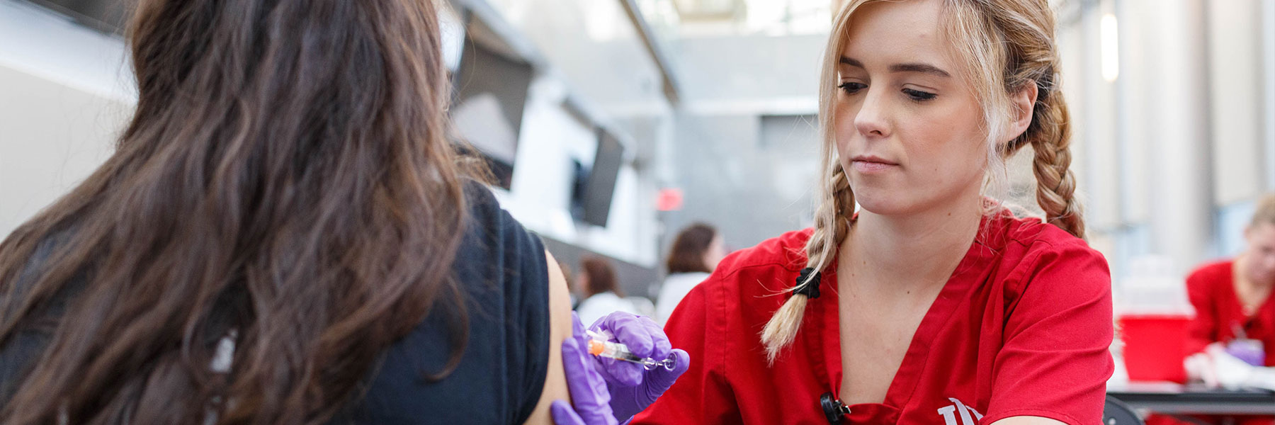 Nursing student at a immunization clinic