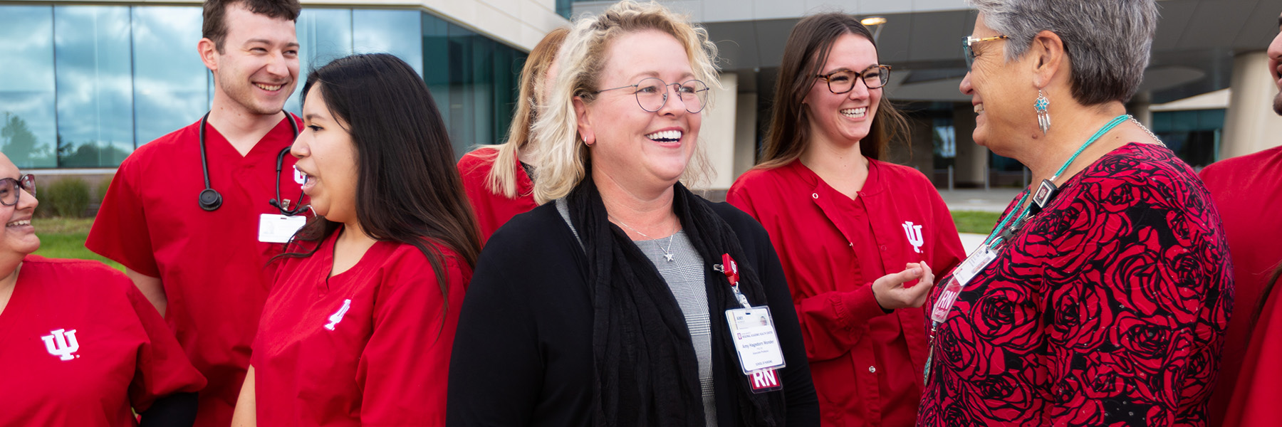 Nursing students and faculty laughing and smiling