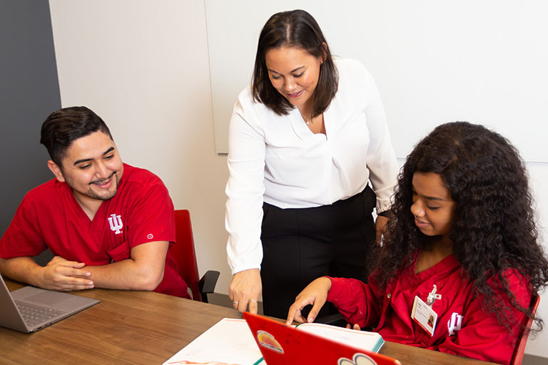 Staff member working with nursing students