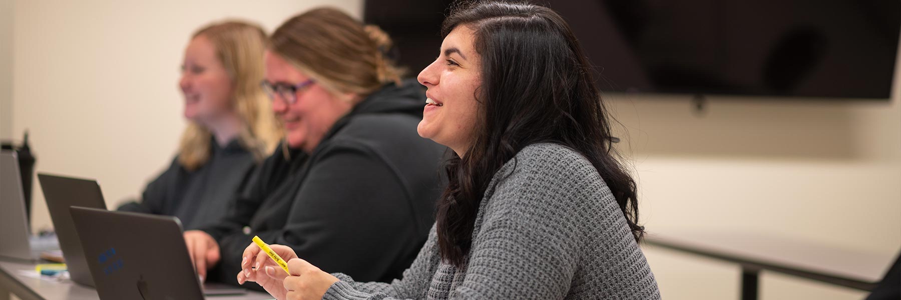 Nursing student laughing during class