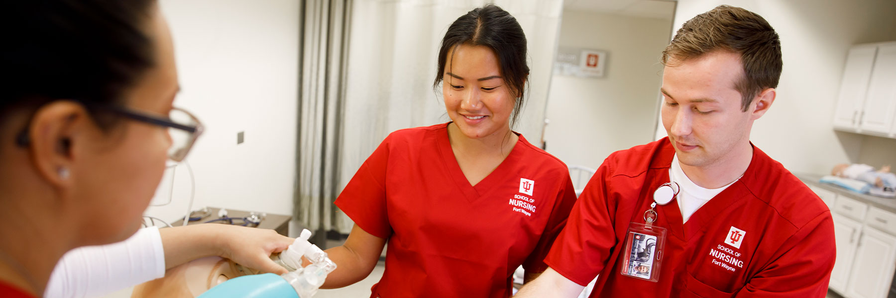 Nursing students doing hands-on learning