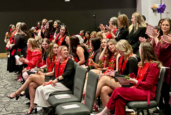 Graduates celebrate their achievements following the pinning ceremony at the IU School of Nursing in Fort Wayne.