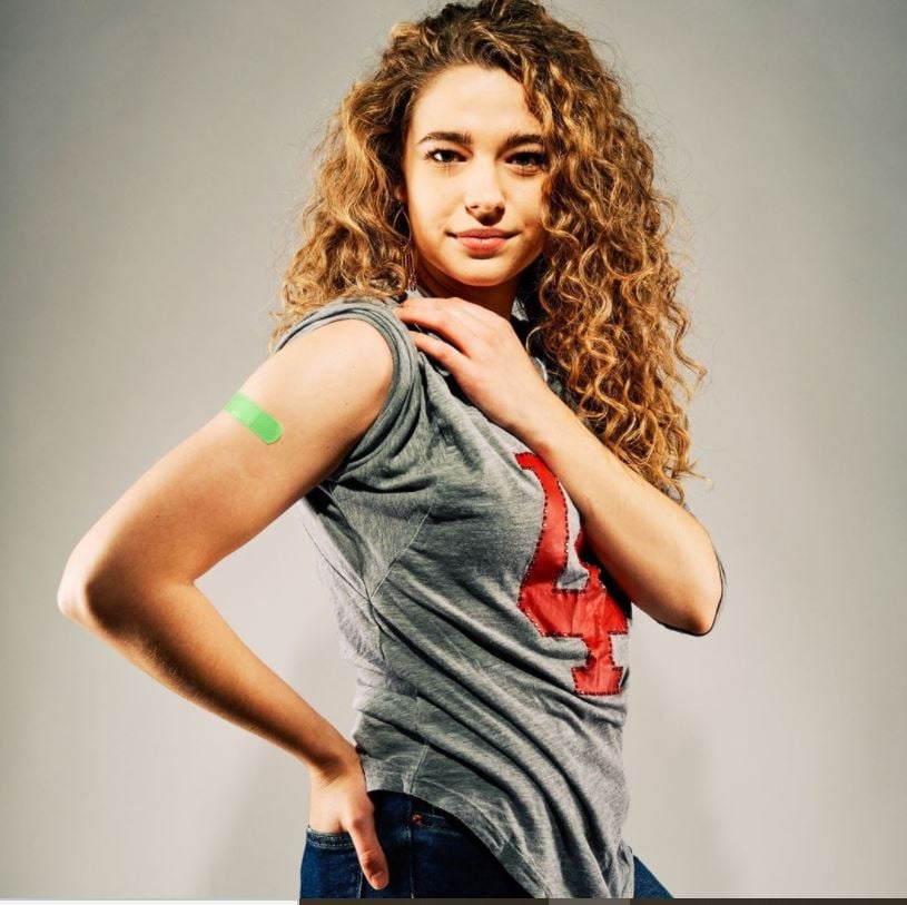 Woman illustrating power of COVID-19 vaccination