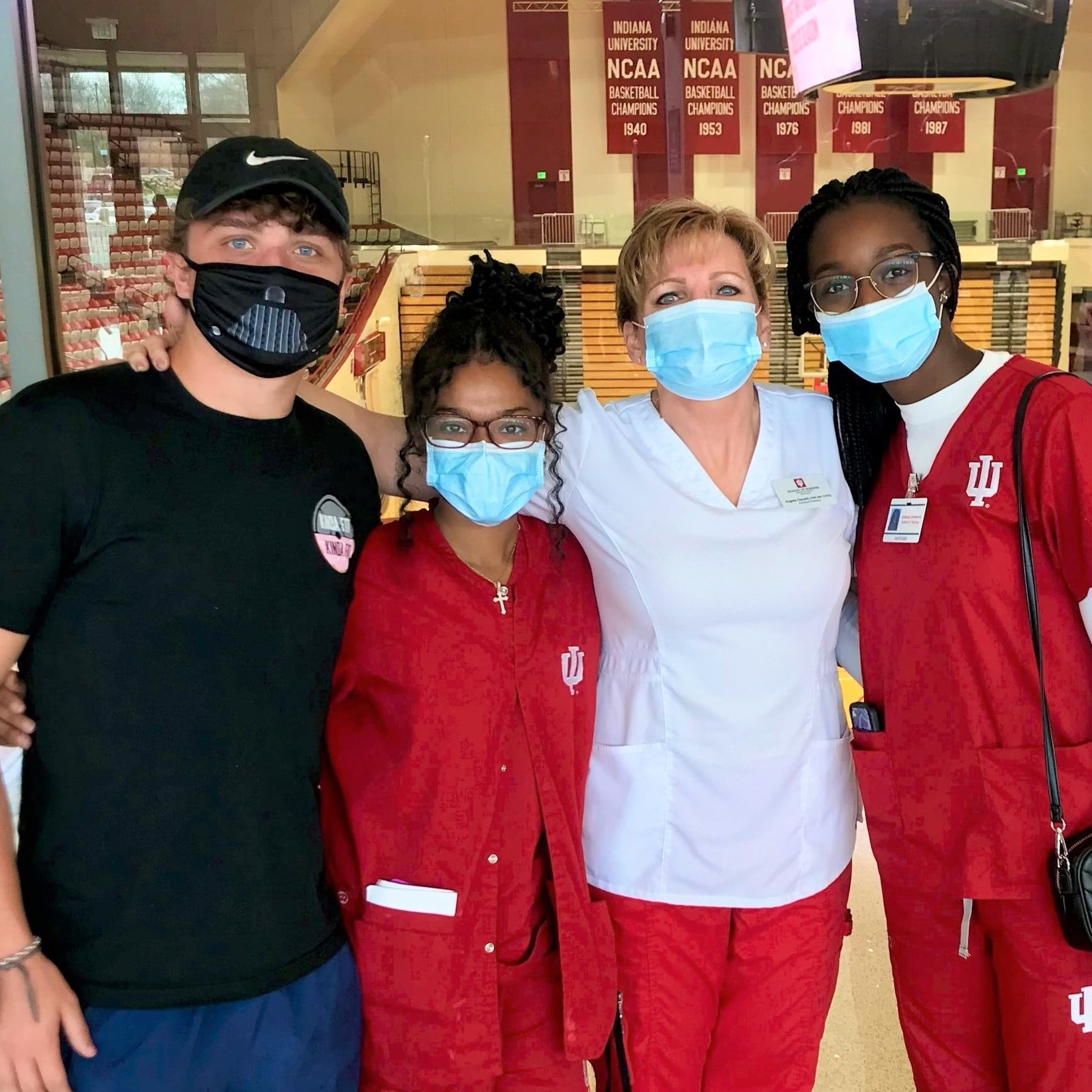 Group of students with faculty facing camera