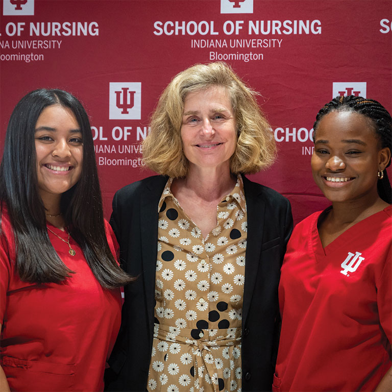 President Whitten and 2 students